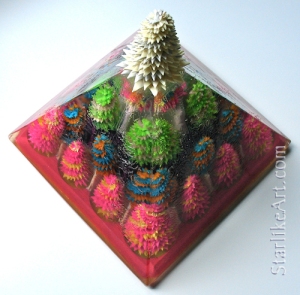 Leo Jean's Starlike© paper sculptures: 24 inside a resin pyramid topped by glowing Starlike©