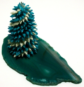 Leo Jean's Starlike© paper sculpture mounted on slice of blue rock